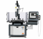 Promag CNC fast-hole EDM machine seen from the front with the CNC screen alongside