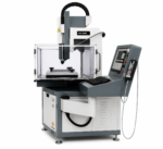 Promag CNC EDM drilling machine with the safety enclosure open and control pendant