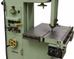 Work table and blade guide of the Dake-Johnson V-16 band saw with the feed control panel