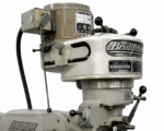 Close-up of the Bridgeport milling head showing the brand plate and quill controls